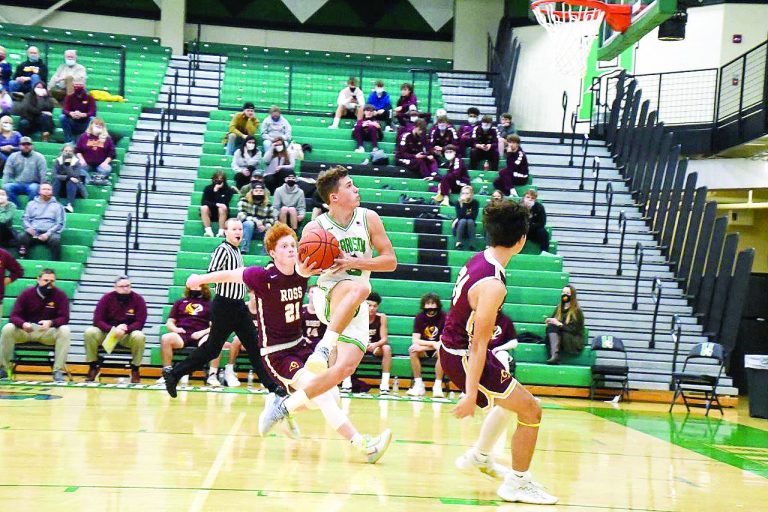 Mason Young goes to the air to shoot in a game against Ross. Photo by Sandy Minor