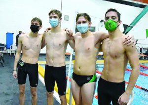 The 100 freestyle relay team of, from left, Danny Reynolds, Michael Nieman, CJ Wesseler and Kyle Manos set a new school record of 50.17 in the match against Talawanda Jan. 16. Photo by Sandy Minor