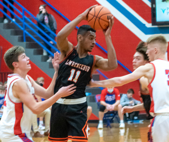 Lawrenceburg’s Dahya Patel (11) is surrounded by defenders in Saturday’s 49-42 overtime win at North Decatur. (Betty Taylor/TaylorMadePhotography)