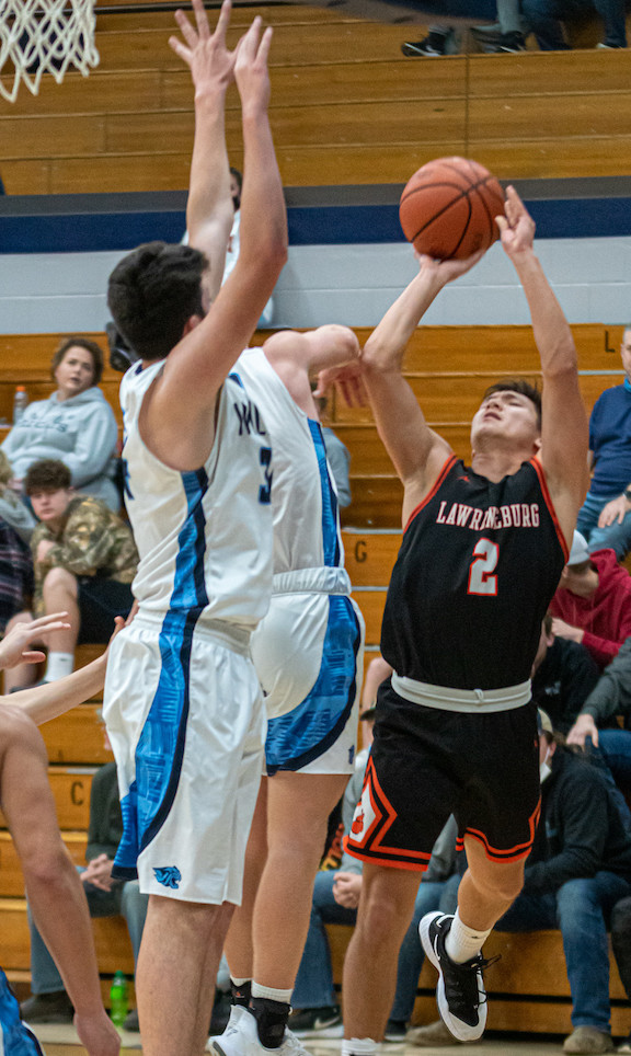 Lawrenceburg's Garrett Yoon (2) pulls up to shoot over a pair of Franklin County defenders in the Tigers' 58-52 EIAC victory Tuesday, Jan. 12, at Brookville. (Betty Taylor/TaylorMadePhotography)