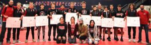 East Central High School wrestlers’ 10 Eastern Indiana Athletic Conference champions display their bracket cards after Saturday’s title victory in the 8-team league meet at South Dearborn. Coach Adam Wolf’s varsity Trojans marked their third-straight EIAC crown and the 12th overall in school history. (Sue Story)