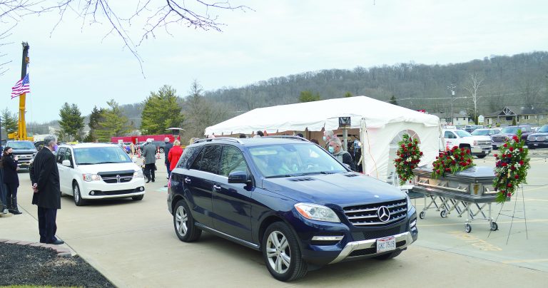 Cars lined the parking lot to pay their respects to Bill McKenna at F&M MAFCO.  Halie Barger/Harrison Press