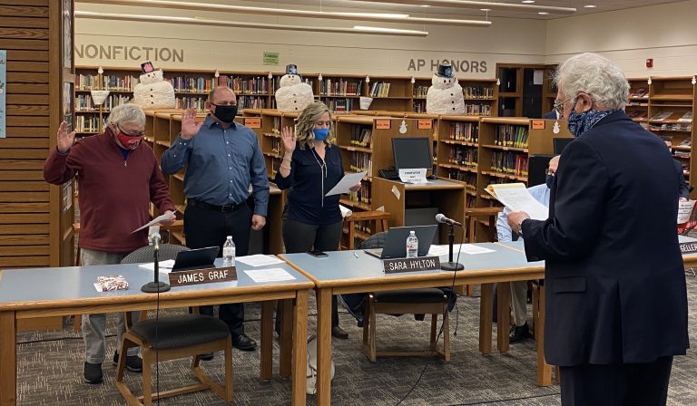 Sunman-Dearborn Community School’s attorney Frank Kramer, right, swears in, from left, Robert (Scot) Davis, James Graf, and Sara Hylton for another term on the board.  Submitted Photo
