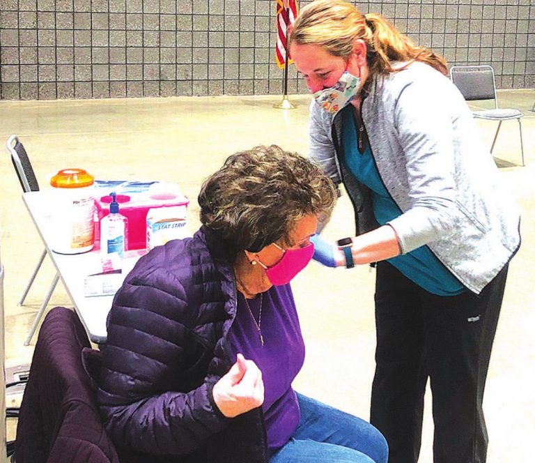 A Dearborn County resident is administered a COVID-19 vaccination on the first day of vaccinations to the public Jan. 11 at the Lawrenceburg Event Center. SUBMITTED PHOTO BY DEARBORN COUNTY HEALTH DEPARTMENT