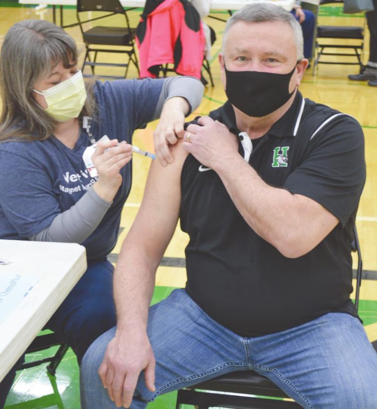 Harrison Junior School math teacher Tom McGraw was given his first dose of the vaccine Feb. 11 by Mercy Health Nurse Amanda Kenczewicz. HALIE BARGER/THE HARRISON-PRESS