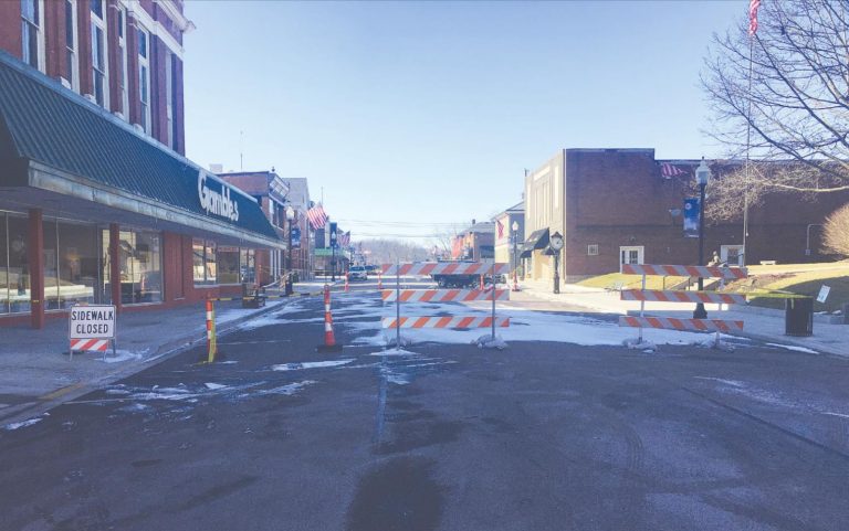 One lane on Second Street in front of the library and Gambles Furniture will be opened after damage to a building caused Aurora to shut traffic down. AARON SMITH/The Register