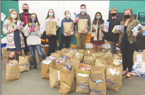 Students at Harrison High School collected hygiene products for the homeless. From left, Chloe Schwettmann, Terrin Jackson, Savannah Strunk, Leah Marx, Josie Farris, Blake Keppler, Kavya Patel, Jack Ward and Lydia Leurck. SUBMITTED PHOTO