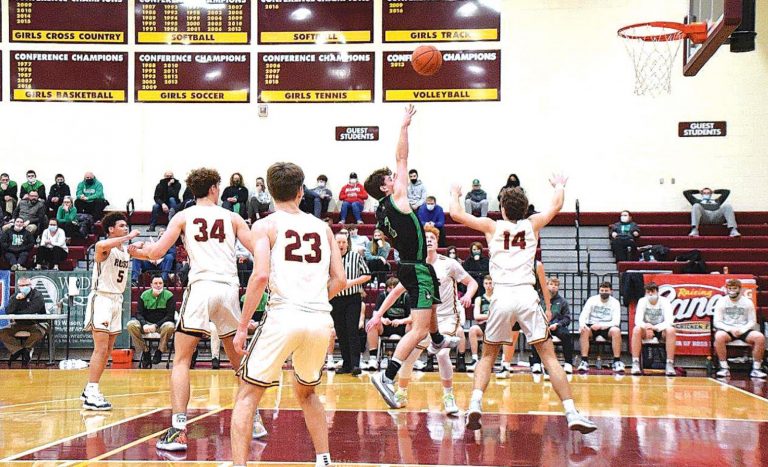 Evan Winia goes up for a shot in the Wildcats game against Ross on Feb. 5. PHOTO BY SANDY MINOR