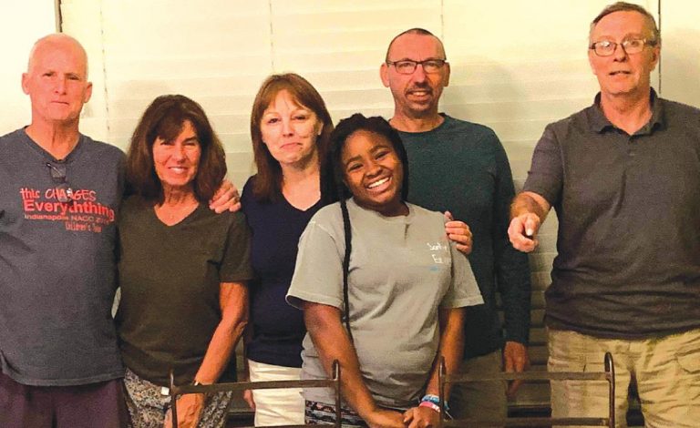 SUBMITTED PHOTO John, Carmen, and Bella Niehaus host Karen Lovern, Kevin Fancher and Tim Hillman at their home in Haiti. Carmen is the principal at Sonlight Academy; and Carmen and John adopted Bella.