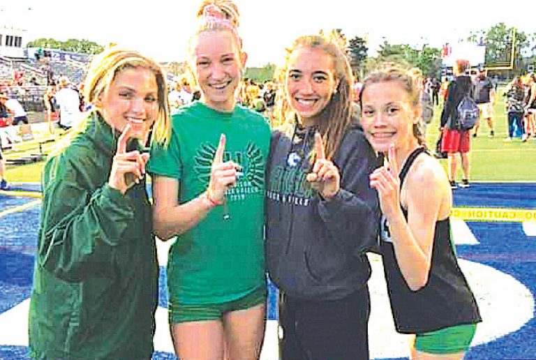 Two current track team members – Senior Ava Tombragel and junior Sarah Helms – helped the girls 4X400 meter relay team to first place in the 2019 Southwest Ohio Conference league meet. That 2019 team were, from left, Tombragel, Emily Mueller, McKenzie Mobley, and Helms. FILE PHOTO BY SANDY MINOR