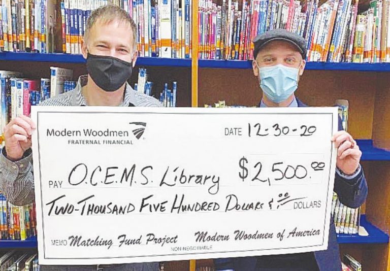 Rising Sun Schools Superintendent Branden Roeder with Beau Jackson of Modern Woodmen of America who donated $2,500 to Ohio County Elementary and Middle School library. SUBMITTED PHOTO