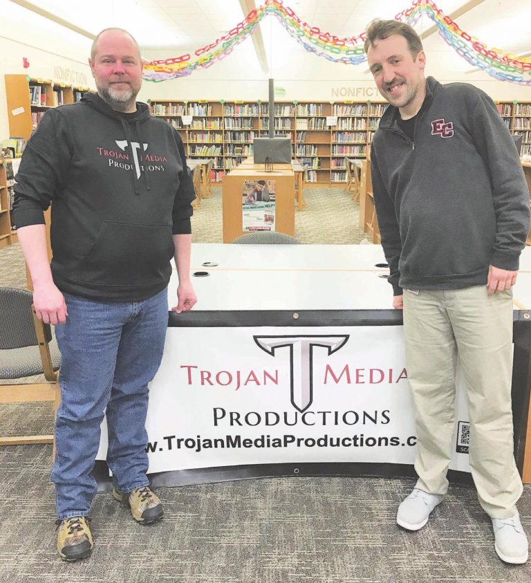 Kevin Leech, left, and Spencer Powell are two of the Trojan Media Productions crew that help stream live events at East Central High School. LAURA A. HOBSON/THE JOURNAL-PRESS