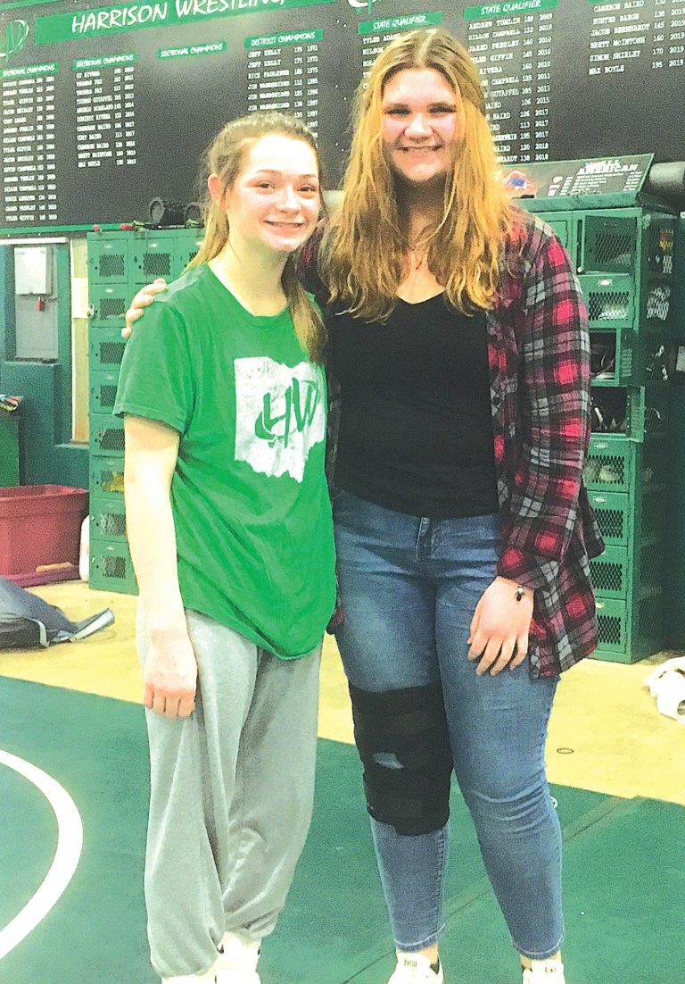 Harrison High School freshmen Chloe Dearwester and Jessica Edwards placed at the Ohio High School Wrestling Coaches Association State Tournament in Hilliard. Dearwester won the 106-pound weight class and Edwards was sixth at 235 pounds. PHOTO BY DICK MALONEY