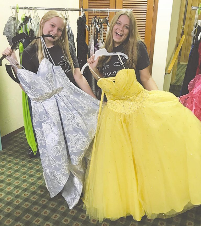 Alexi and Lyndsi Moore collected gowns to donate to girls going to school dances as a part of Be Kind Harrison’s monthly service project. SUBMITTED PHOTO