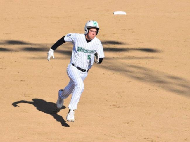 Wildcat Grant Morse speeds around second base during Harrison’s game against Mount Healthy April 14. PHOTO BY SANDY MINOR