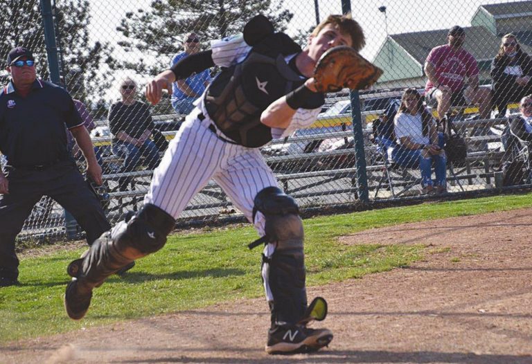 Catcher Cade Combs catches a pop up right in front of the plate in the Wildcats game against Edgewood April 5. PHOTO BY SANDY MINOR