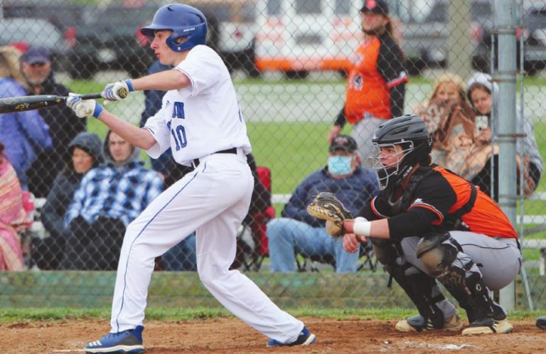 Lawrenceburg catcher Colin Mueller awaits the pitch as Rising Sun’s Braylan Williams squares to bunt in the Tigers’ 22-5 season opening win March 31 at RS. MASON J. UHLMANSIEK