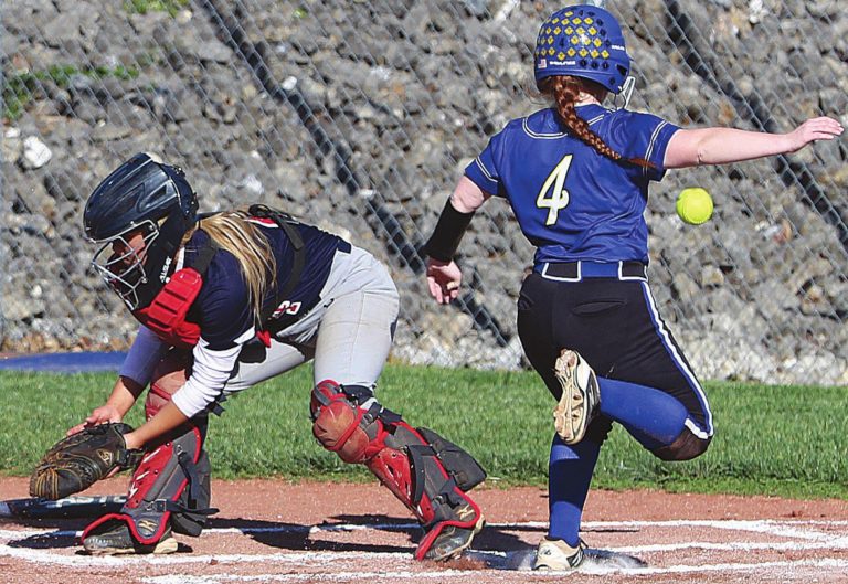 Rising Sun junior Josie Bell scores ahead of the errant throw to home plate in the Lady Shiners’ 16-1, 5-inning conference victory over Southwestern (Hanover) Wednesday, May 5, at David & Butch Brown Stadium. MASON J. UHLMANSIEK