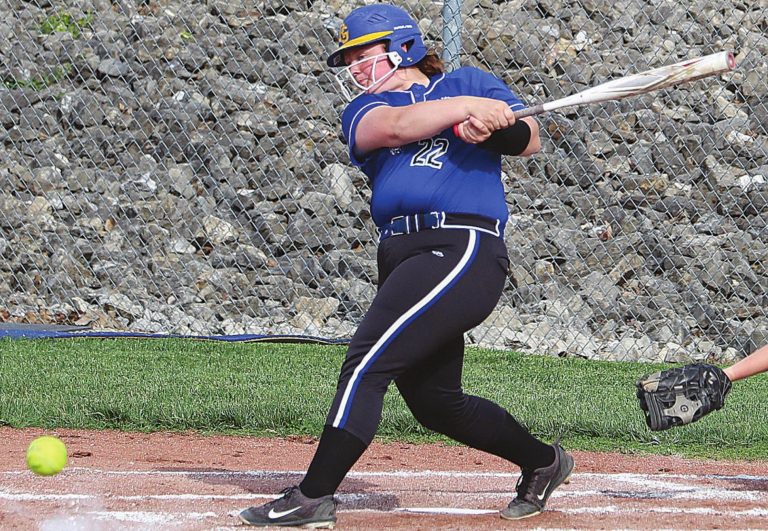 Rising Sun junior Ella Eldridge (22) connects for a hit in the Lady Shiners’ 17-0 varsity softball win over Oldenburg Academy at David & Butch Brown Stadium Monday, May 10. The victory started a current 5-game win streak. MASON J. UHLMANSIEK