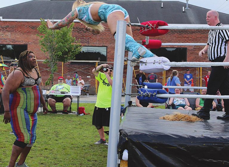Wrestlers from Battle On The Border Pro Wrestling performed a match to benefit the Aurora City Pool renovation June 12 at downtown Aurora’s Gabbard Park. MATT POPOVICH/THE JOURNAL-PRESS