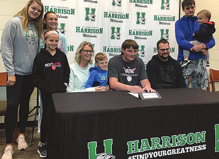 Harrison High School graduate Brady Robertson with family after signing a letter-of-intent with University of Northwestern Ohio May 29. PHOTO BY DICK MALONEY
