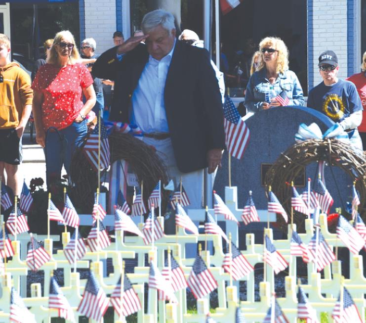 Bernie Huff lays a wreath during the Rising Sun and Ohio County Memorial Day ceremony. MARC EMRAL/THE RECORDER & NEWS