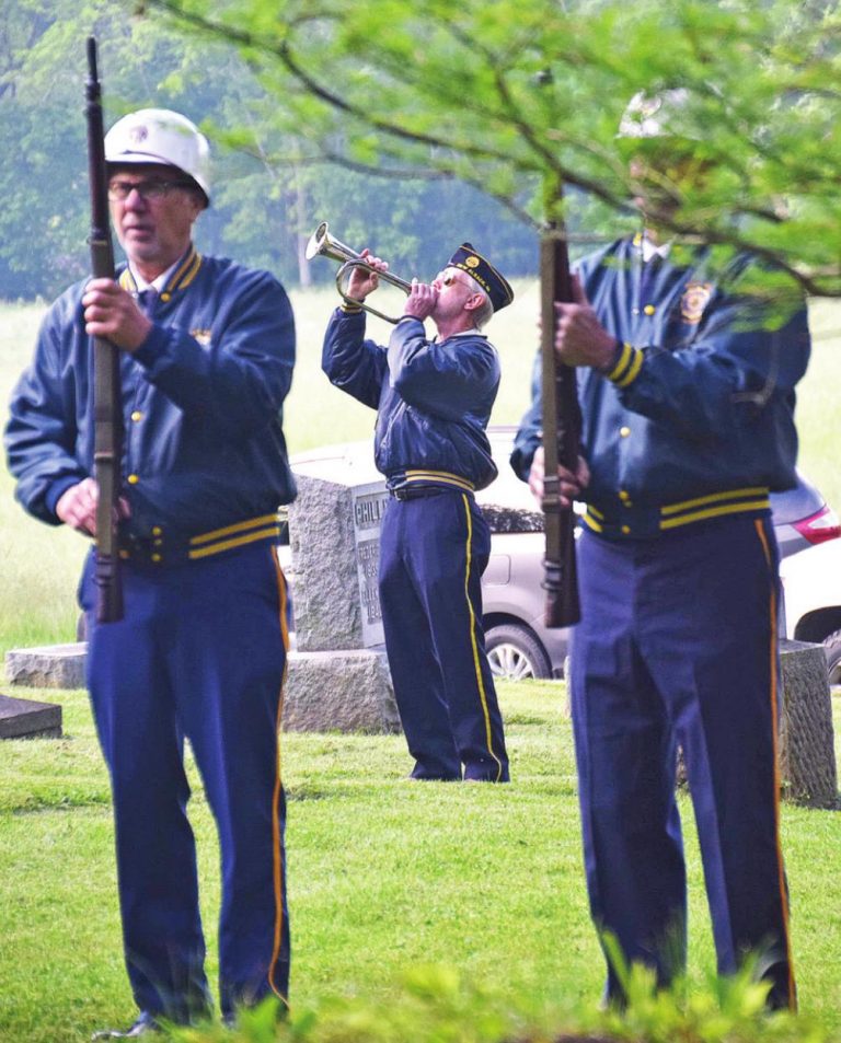 Jim Carter plays taps at West Fork Cemetery on May 31 during North Dearborn American Legion Post 452’s Memorial Day ceremony. The post visited six different cemeteries that morning. See more photos from Memorial Day ceremonies at www.registerpublications.com. MARC EMRAL/THE REGISTER