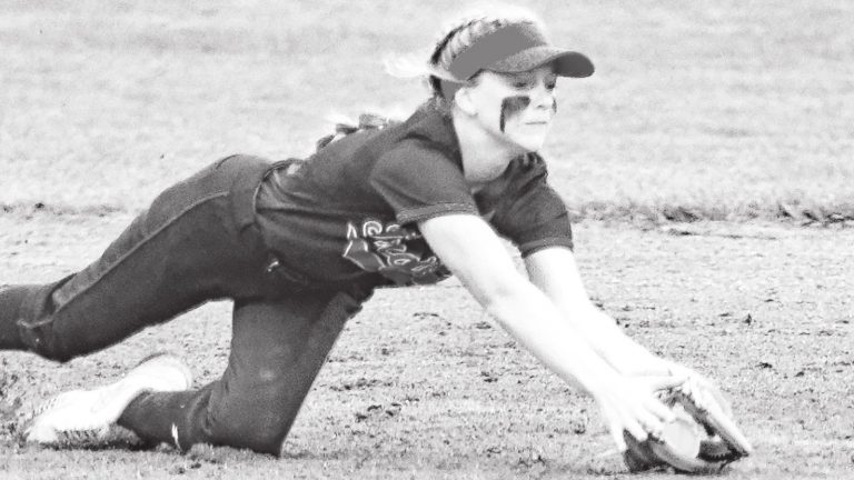 East Central’s Lexi Hatmaker makes a diving catch on a shot off the bat of Columbus North’s Lillian Mackey in last Friday’s 6-1 Class 4A softball sectional championship at Shelbyville. SANDY MAHONEY