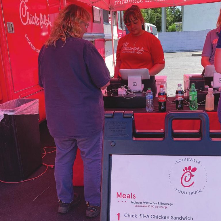 Gail Clingerman is shown paying for her order when the Chick-fil-A Louisville Food truck came to visit on June 22 hosted by Rising Sun/Ohio County Tourism. BETH TERRILL/THE RECORDER AND NEWS