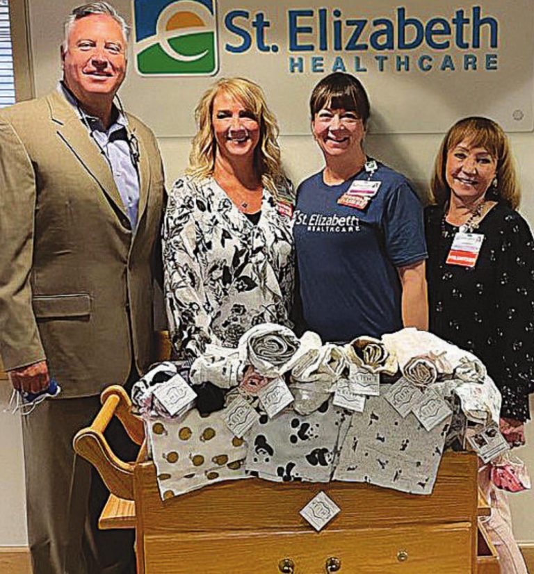 With blankets donated to the birthing center at St. Elizabeth Dearborn Hospital are, from left, Chris Carle,, chief operating officer at St. Elizabeth Dearborn; Angela Roberts, vice president and chief nursing officer at St. Elizabeth Dearborn; Jacquie Ritzmann, manager of the birthing center; and Claudia Richardt, a volunteer at St. Elizabeth Dearborn. SUBMITTED PHOTO