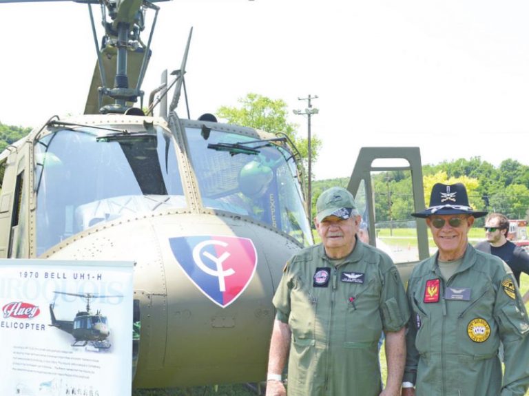 Dave Williams (left) and Ken Wiggers are members of the Columbus Huey organization that brought the helicopter to Thank a Vet Day at the VFW in Harrison. HALIE BARGER/THE HARRISON-PRESS