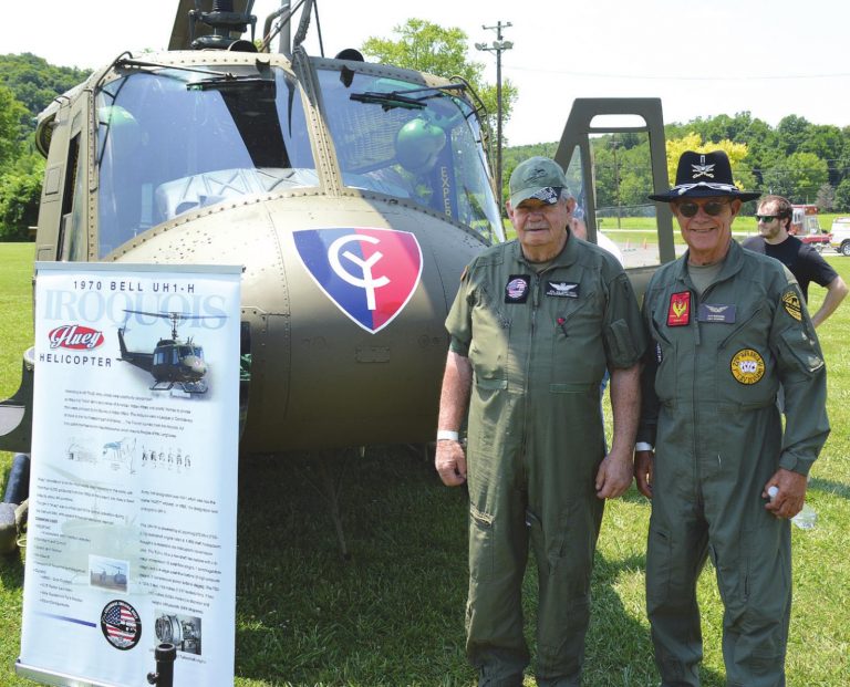Dave Williams, left, and Ken Wiggers are members of the Columbus Huey organization that brought the helicopter to Thank a Vet Day at the VFW in Harrison. HALIE BARGER/THE HARRISON-PRESS