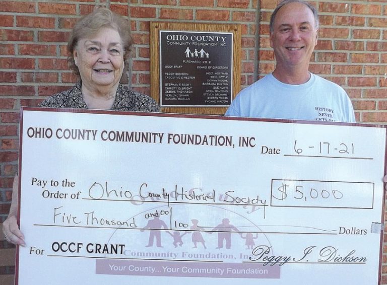 Peg Dickson, Ohio County Community Foundation executive director, presents a check to Cliff Thies, director of the Ohio County Historical Society. SUBMITTED PHOTO