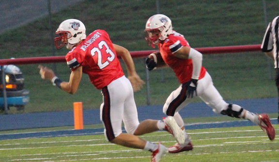 South Dearborn senior Drew Probst (right) returns one of the Knights’ 4 interceptions, with Ryan Willoughby (23) looking for a block, in Friday’s 56-26 romp over Seymour.